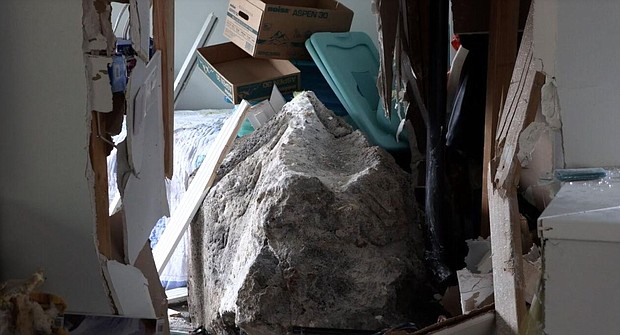 A 65-year resident of Palolo, Hawaii, Caroline Sasaki said she has never heard of a boulder falling from the west side of the valley, until one plunged into her own home over the weekend.
Mandatory Credit:	KITV