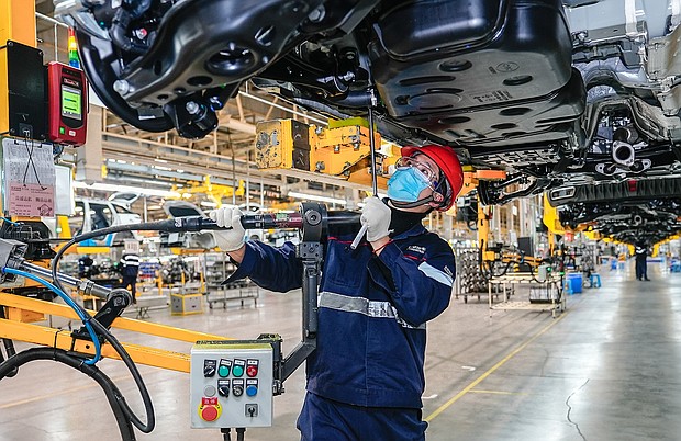An employee works at an automobile manufacturing enterprise on January 29 in Hefei, Anhui Province of China. Chinese factories resumed work after the Spring Festival holiday.
Mandatory Credit:	Ge Qingzhao/VCG/Getty Images