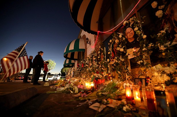 A mass shooting, defined as having injured or killed four or more people, occurred at least 47 times in the US in just the first four weeks of 2023, according to the Gun Violence Archive, and pictured, people pay their respects at the memorial for 11 people who died in a mass shooting during Lunar New Year celebrations outside the Star Ballroom Dance Studio in Monterey Park on January 26.
Mandatory Credit:	Genaro Molina/Los Angeles Times/Getty Images