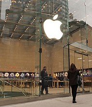 After several years of raking in profits thanks to strong demand for tech gadgets and services during the pandemic, the industry’s fortunes began to turn last year, and pictured, people walk along Broadway in front of the Apple retail store on January 10, in New York City.
Mandatory Credit:	Gary Hershorn/Corbis News/Getty Images