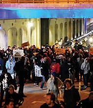 Protesters march Jan. 27 in Memphis, Tenn., as authorities release police video depicting five Memphis officers beating Tyre Nichols, whose death resulted in murder charges and provoked outrage at the country’s latest instance of police brutality.