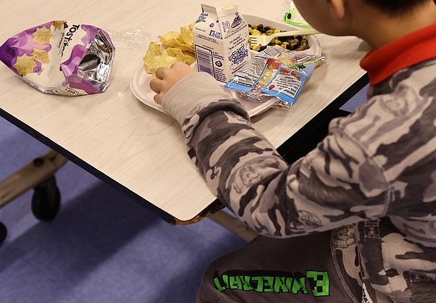 Proposed changes to school lunches aim to reduce sugar and sodium. A student here eats his lunch at a school in New York City on February 4, 2022.
Mandatory Credit:	Michael Loccisano/Getty Images