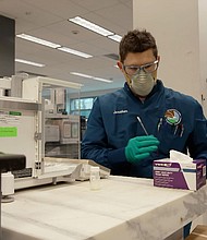 A DEA scientist works at the DEA drug testing lab.
Mandatory Credit:	CNN
