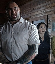 Dave Bautista, Abby Quinn and Nikki Amuka-Bird in director M. Night Shyamalan's adaptation "Knock at the Cabin."
Mandatory Credit:	Universal Pictures