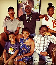 Author Derrick Barnes, center top, and his family.
Mandatory Credit:	Courtesy Derrick Barnes