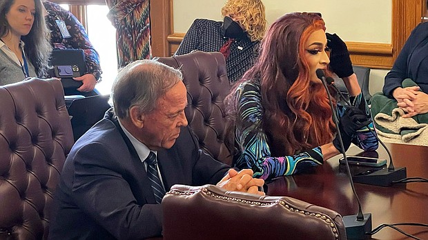 Drag performer MD Hunter, whose stage name is Athena Sinclair, testifies before a state Senate panel as state Sen. Gary Stubblefield, left, listens, at the Arkansas Capitol in Little Rock, Arkansas, on January 19.
Mandatory Credit:	Andrew DeMillo/AP