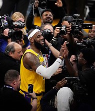 LeBron James after scoring to pass Kareem Abdul-Jabbar's record as the NBA's all-time leading scorer.
Mandatory Credit:	Marcio Jose Sanchez/AP