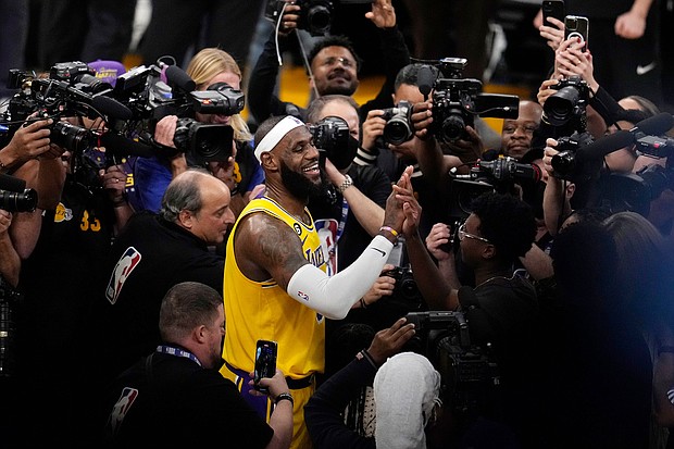 LeBron James after scoring to pass Kareem Abdul-Jabbar's record as the NBA's all-time leading scorer.
Mandatory Credit:	Marcio Jose Sanchez/AP