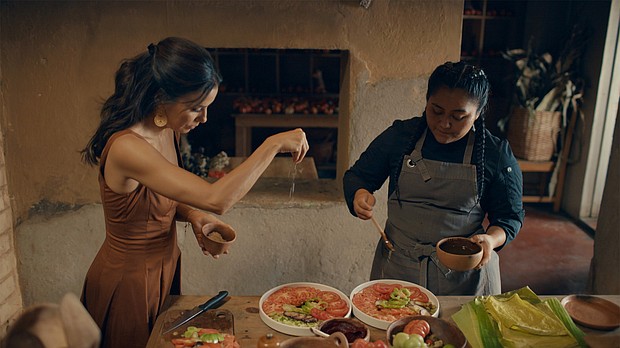 Chef Thalía Barrios García (right) drizzles the salad with the vinaigrette, while Eva Longoria adds flaky salt. "It's important to preserve this way of eating. The way that nourished our ancestors," García said.
Mandatory Credit:	CNN