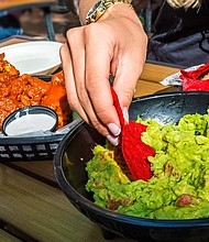 Chicken wings and guacamole will cost less this year.
Mandatory Credit:	andykazie/iStockphoto/Getty Images