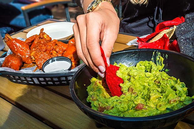 Chicken wings and guacamole will cost less this year.
Mandatory Credit:	andykazie/iStockphoto/Getty Images