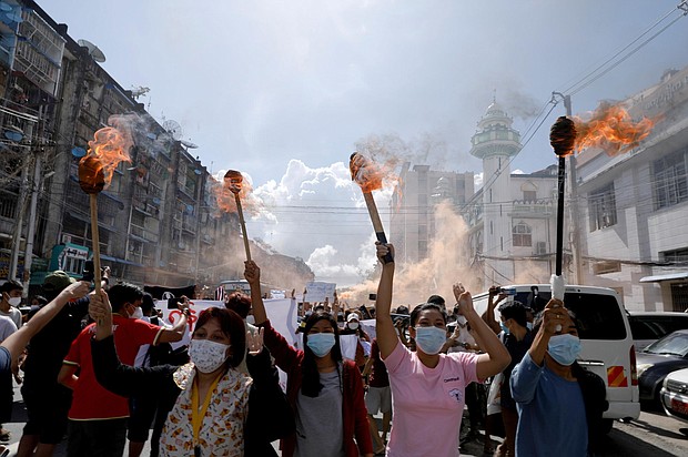 A group of women hold torches as they protest against the military coup in Yangon, Myanmar July 14, 2021.
Mandatory Credit:	Stringer/Reuters/FILE