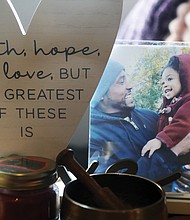 A photograph shows Marcus Lynch and his daughter, Primrose, framed on the family’s coffee table in their Henrico home.