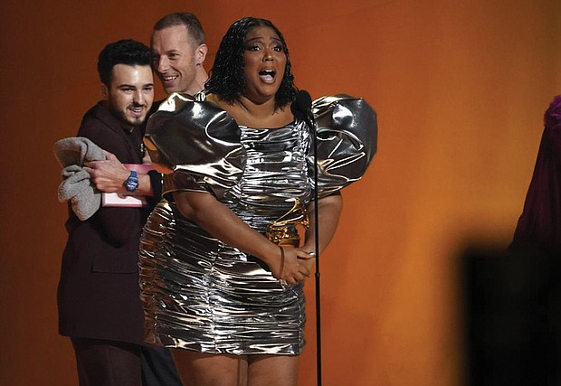 Lizzo accepts the award for record of the year for “About Damn Time.”