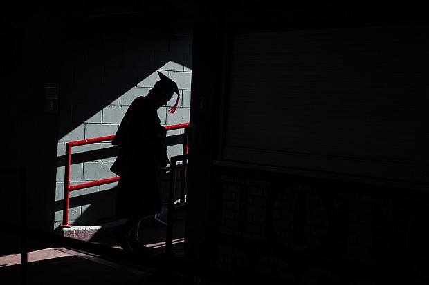 Students arrive at Fenway Park for the Northeastern University Commencement in Boston on May 13.
Mandatory Credit:	Erin Clark/The Boston Globe/Getty Images