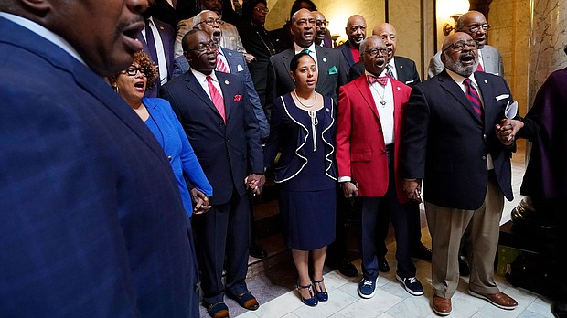 Members of the Mississippi Legislative Black Caucus hold hands and sing "We Shall Overcome" following a news conference where they expressed disappointment at the passage of House Bill 1020.
Mandatory Credit:	Rogelio V. Solis/AP