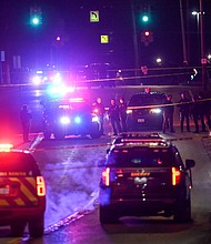 Police work the scene where a man suspected of a shooting on the Michigan State University campus February 14, in Lansing.
Mandatory Credit:	Nick King/Lansing State Journal/USA Today