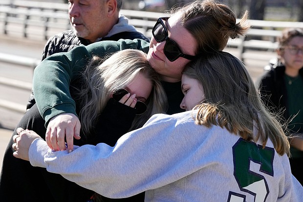 Michigan State University students embrace at The Rock on campus on February 14.
Mandatory Credit:	Carlos Osorio/AP