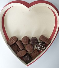 Edgar Dworsky removed all of the packaging from inside of the Whitman's Sampler chocolate box and saw that the chocolate pieces only filled about one-third of the box.
Mandatory Credit:	Consumer World