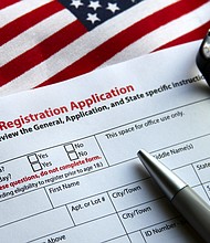 Voter registration form with flag of United States of America.