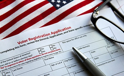 Voter registration form with flag of United States of America.