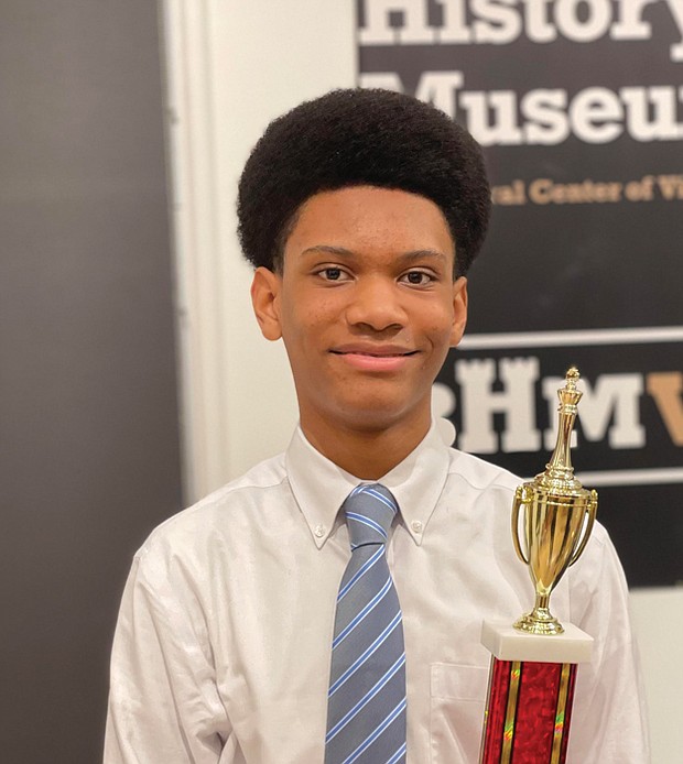 Jace Miles celebrates his victory in the 2nd Annual Bright Minds RVA Chess Tournament at the awards presentation Friday night at the Black History Museum and Cultural Center of Virginia. The 13-year-old Henderson Middle School student, the son of Michael and Otesa Miles, received a trophy and $400 for his first place showing in the four-round competition involving 10 youths. Jace started playing chess in an afternoon elementary school program. During the early days of the COVID-19 pandemic, he further developed his chess skills by playing online with a cousin who lives in New York. In between, he continued to play the game.