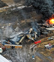 This photo taken with a drone shows portions of a Norfolk Southern freight train that derailed February 3 in East Palestine, Ohio, were still on fire, February 4.
Mandatory Credit:	Gene J. Puskar/AP