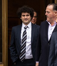 FTX founder Sam Bankman-Fried (L), here on February 9, is set to appear in New York federal court Thursday for the second time this week  as prosecutors seek stricter bail rules.
Mandatory Credit:	Yuki Iwamura/AFP/Getty Images