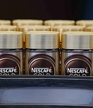 Nestlé says the price of staple items will rise further this year. Pictured is a Nestlé production line in Orbe, Switzerland, on May 20, 2021.
Mandatory Credit:	Stefan Wermuth/Bloomberg/Getty Images