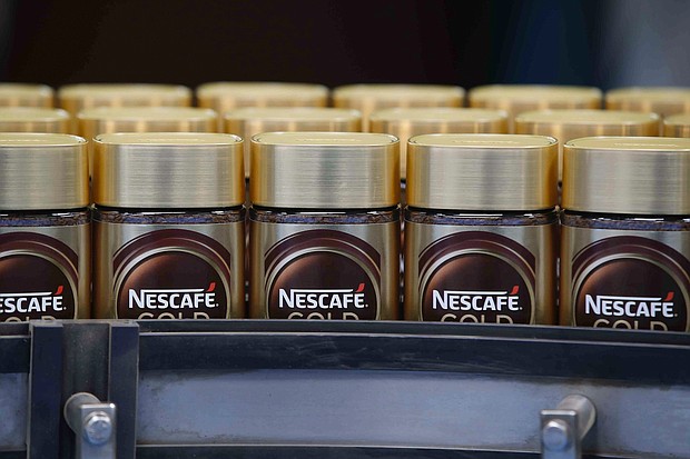 Nestlé says the price of staple items will rise further this year. Pictured is a Nestlé production line in Orbe, Switzerland, on May 20, 2021.
Mandatory Credit:	Stefan Wermuth/Bloomberg/Getty Images