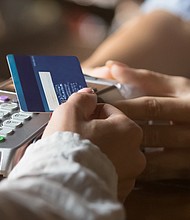Americans continued to add to their debt at the end of last year — and grew their credit card balances at record rates.
Mandatory Credit:	Adobe Stock