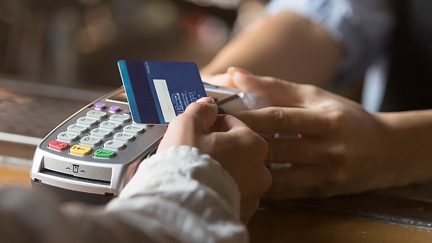 Americans continued to add to their debt at the end of last year — and grew their credit card balances at record rates.
Mandatory Credit:	Adobe Stock