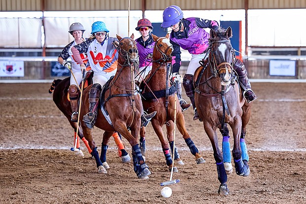 Wendy Stover playing for Herk's Store & Grill in front of the pack at Legends Polo Club 2022 Texas Arena League photo - Murrell Photography