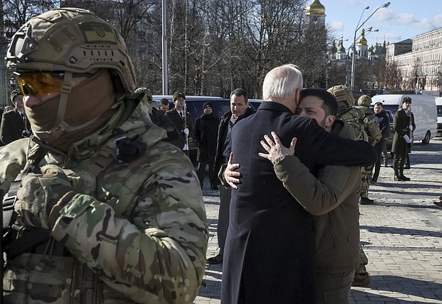 President Joe Biden and Ukraine's President Volodymyr Zelenskiy embrace after their visit to the Wall of Remembrance to pay tribute to killed Ukrainian soldiers, in Kyiv, Ukraine, February 20.
Mandatory Credit:	Gleb Garanich/Reuters