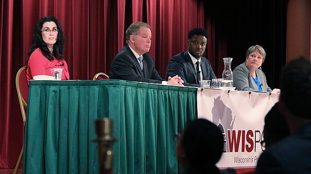 Wisconsin state Supreme Court candidates, from left, Jennifer Dorow, Dan Kelly, Everett Mitchell and Janet Protasiewicz participate in a candidate forum in Madison on January 9.
Mandatory Credit:	John Hart/Wisconsin State Journal/AP