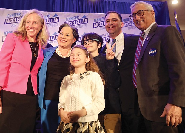 After delivering her victory speech in becoming Virginia’s first Black congresswoman Tuesday, state Sen. Jennifer L. McClellan, second from left, is surrounded by Rep. Abigail Spanberger, 7th District, her two children, Jackson,12, Samantha, 7, her husband, David Mills, and Rep. Bobby Scott, 3rd District.