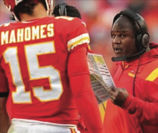 Eric Bieniemy Jr., who is leaving the Kansas City Chiefs to become the Washington Commanders’ new assistant head coach, talks with Patrick Mahomes on the sidelines.