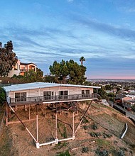 This Los Angeles home was built in 1962 on stilts over which the home seems to float.