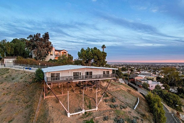 This Los Angeles home was built in 1962 on stilts over which the home seems to float.