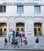 People walk around outside The Fulton County Court House on September 29, 2022 in Atlanta, Georgia.
Mandatory Credit:	Megan Varner/Getty Images
