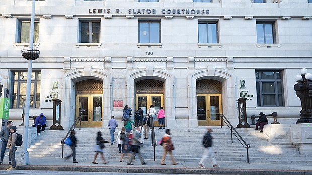 People walk around outside The Fulton County Court House on September 29, 2022 in Atlanta, Georgia.
Mandatory Credit:	Megan Varner/Getty Images