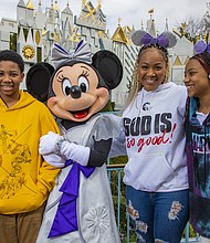 Award-winning singer and radio show host Erica Campbell and her family enjoy an unforgettable day at Disneyland Park in Anaheim, Calif., before she takes the stage as the headlining talent of “Celebrate Gospel” on Feb. 25, 2023. Erica and her kids, Zaya and Warryn, share a magical moment with Minnie Mouse in front of “it’s a small world.” “Celebrate Gospel” is part of Celebrate Soulfully at Disneyland Resort, where guests are invited to join a soulful celebration of Black heritage and culture through experiences, music, food and more. (Christian Thompson/Disneyland Resort)