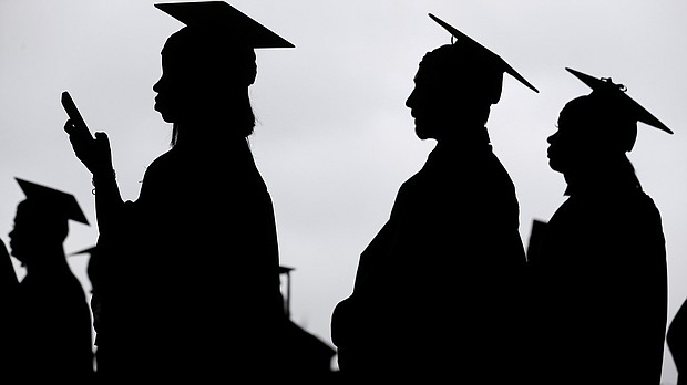 President Joe Biden's student loan forgiveness plan goes before the Supreme Court Tuesday. New graduates line up before the start of a community college commencement in East Rutherford, N.J., in 2018.
Mandatory Credit:	Seth Wenig/AP