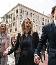 Theranos founder Elizabeth Holmes (C), here in San Jose, in 2022, gave has given birth to her second child, according to a court filing last week.
Mandatory Credit:	Amy Osborne/AFP/Getty Images