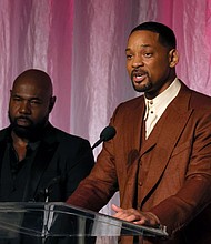 Honorees Antoine Fuqua (left) and Will Smith accept The Beacon Award for "Emancipation" onstage during the 14th Annual AAFCA Awards on Wednesday.
Mandatory Credit:	Jemal Countess/Getty Images