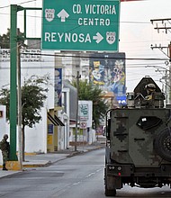 The FBI is seeking the public's help in locating the four Americans kidnapped in Matamoros, Mexico, on Friday. Pictured are members of the National Guard in the border city of Matamoros, Mexico, in 2021.
Mandatory Credit:	Alfredo Estrella/AFP/Getty Images/File