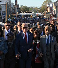 US President Joe Biden, joined by US Representative Terri Sewell (D-AL), Reverend Al Sharpton, Reverend Jesse Jackson, Martin Luther King III, and fellow activists cross the Edmund Pettus Bridge in Selma, Alabama, on March 5, 2023, to mark the 58th anniversary of Bloody Sunday. - More than 600 civil rights demonstrators were beaten by white police officers as they tried to cross the bridge during a 54 mile march from Selma to Montgomery, on March 7, 1965. (Megan Ngan/AFP via Getty Images/TNS)