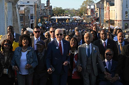 US President Joe Biden, joined by US Representative Terri Sewell (D-AL), Reverend Al Sharpton, Reverend Jesse Jackson, Martin Luther King III, and fellow activists cross the Edmund Pettus Bridge in Selma, Alabama, on March 5, 2023, to mark the 58th anniversary of Bloody Sunday. - More than 600 civil rights demonstrators were beaten by white police officers as they tried to cross the bridge during a 54 mile march from Selma to Montgomery, on March 7, 1965. (Megan Ngan/AFP via Getty Images/TNS)