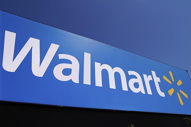 The Walmart logo is displayed on a store in Springfield, Ill., May 16, 2011. (AP Photo/Seth Perlman, File)