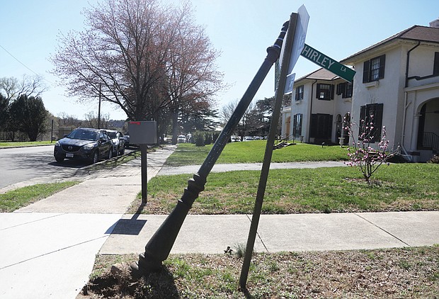 A city street sign leans at the corners of Shirley Lane and Westover Road in Richmond’s Byrd Park on March 4. A nearby hole is equally dangerous. Hopefully an employee in the City of Richmond’s Department of Public Works soon will attend to this potentially hazardous situation.